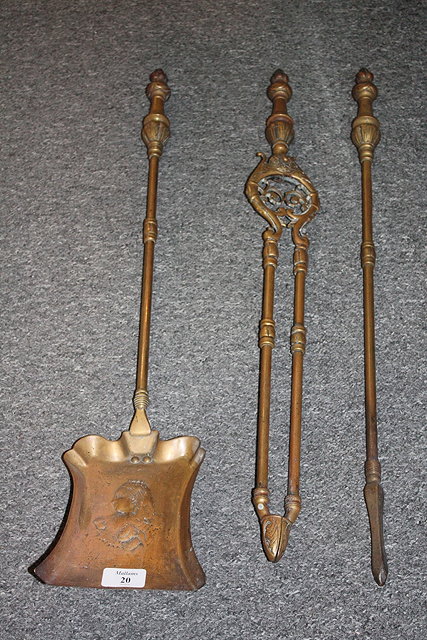 Appraisal: A SET OF THREE VICTORIAN BRASS FIRE IRONS the shovel