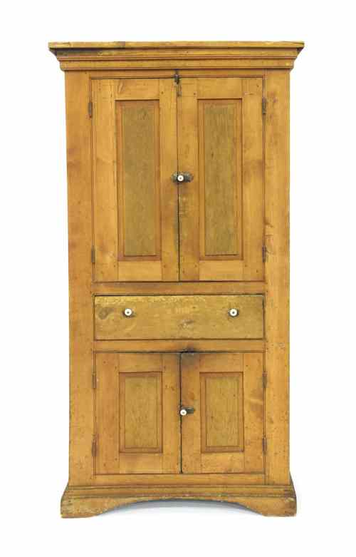 Appraisal: Stained pine and maple wall cupboard th c h w