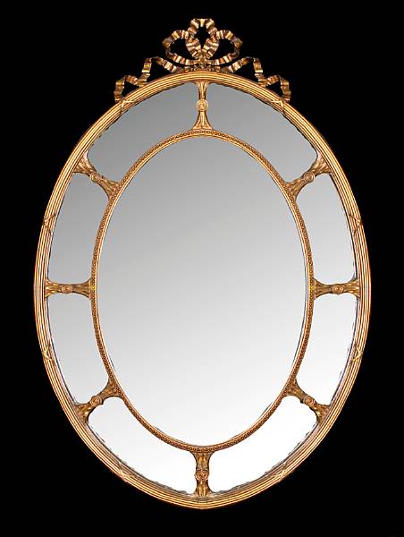 Appraisal: A Neoclassical style oval wall mirror height in width in