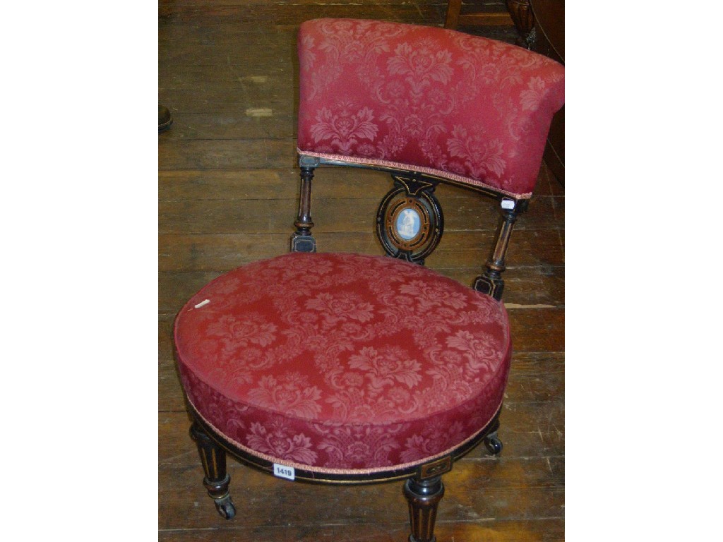 Appraisal: A Victorian ebonised occasional chair with upholstered seat and back