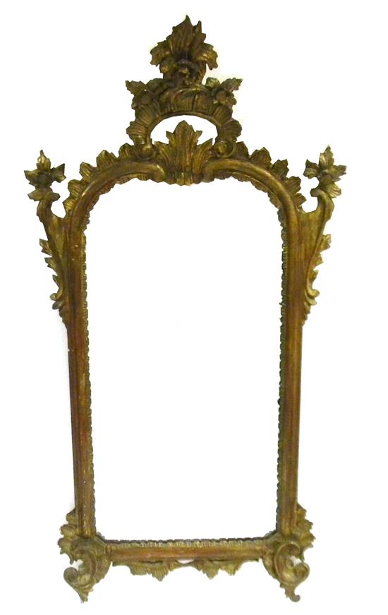 Appraisal: Rococo style wall mirror antiqued finished frame with elaborate scroll