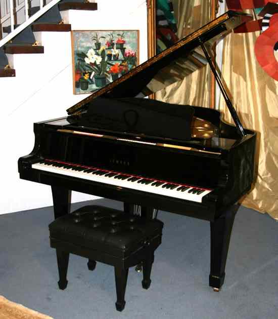 Appraisal: YAMAHA BLACK LACQUER BABY GRAND PIANO Together with matching adjustable