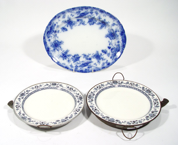 Appraisal: Two Edwardian tin warming plates with blue transfer printed decoration