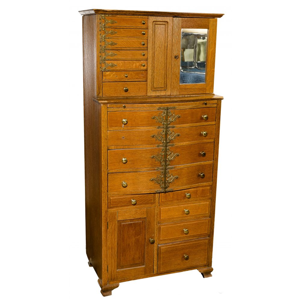 Appraisal: OAK DENTAL CABINETHaving a stepped-back upper section with trays that