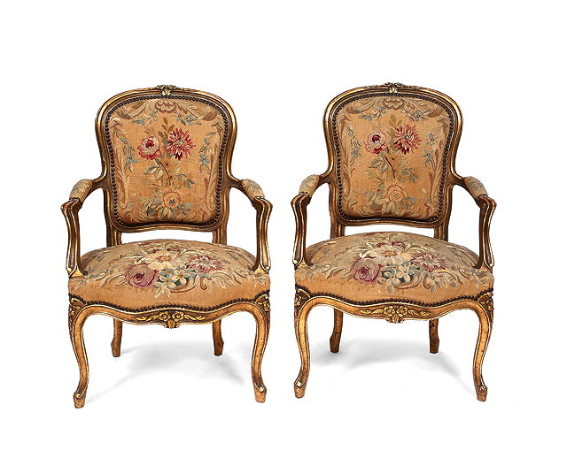 Appraisal: A PAIR OF LOUIS XVI STYLE GILT OPEN ARMCHAIRS with