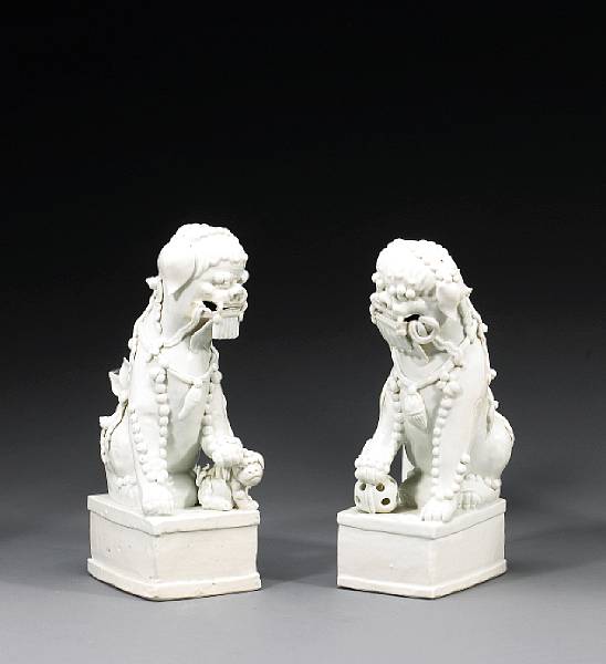 Appraisal: A pair of Dehua porcelain lion dogs th Century Each