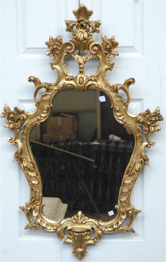 Appraisal: GILT WOOD MIRROR Carved and gilt rococo style cartouche form