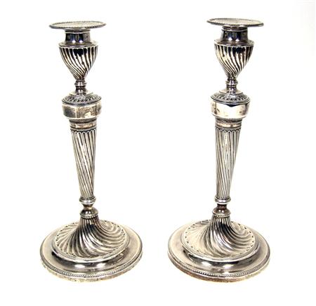 Appraisal: A pair of late Victorian candle sticks Elkingtons Sheffield the