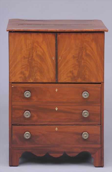 Appraisal: GEORGE III MAHOGANY BEDSIDE CUPBOARD The hinged top opening to