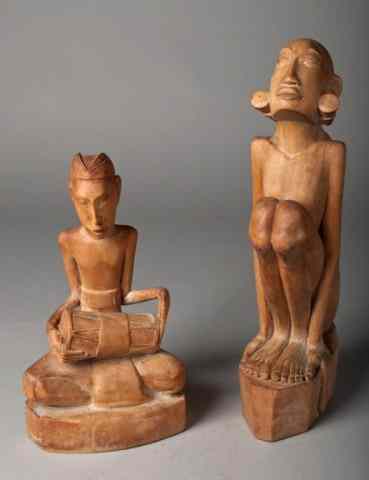 Appraisal: Pr Of Finely Carved African Wood FiguresOne depicting a female