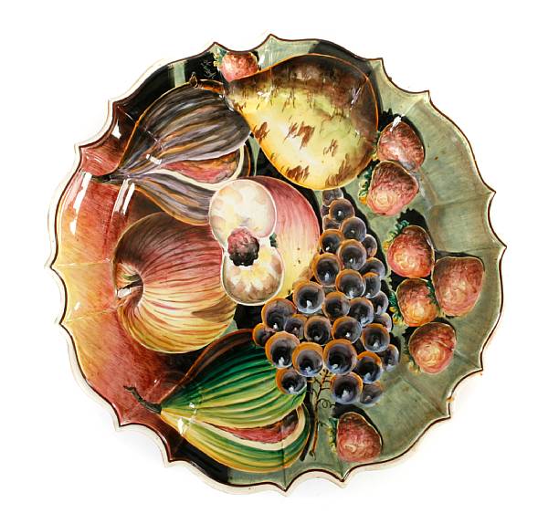 Appraisal: A large Italian glazed earthenware charger decorated with fruit diameter