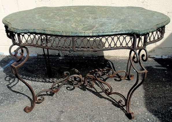 Appraisal: Wrought iron table with a marble top h top l