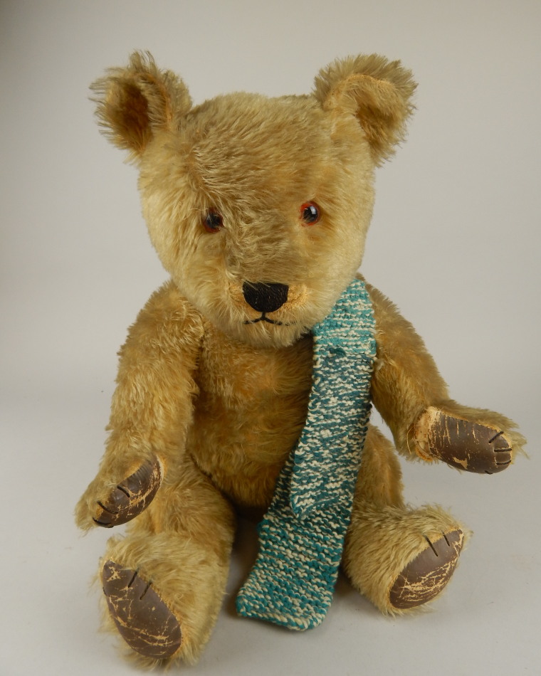 Appraisal: An early thC plush blonde jointed Teddy bear with glass