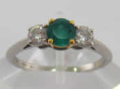 Appraisal: A Tiffany emerald and diamond three stone ring the central