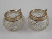 Appraisal: A pair of cut glass salts with silver rims London