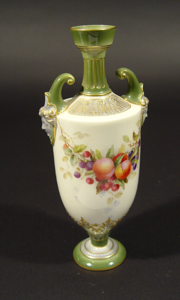 Appraisal: Royal Worcester vase with mask design handles hand painted with