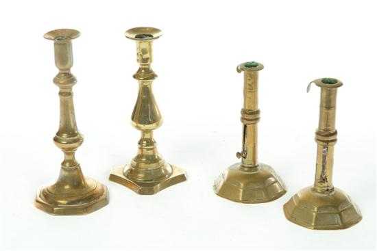 Appraisal: FOUR BRASS CANDLESTICKS American or English th century A pair