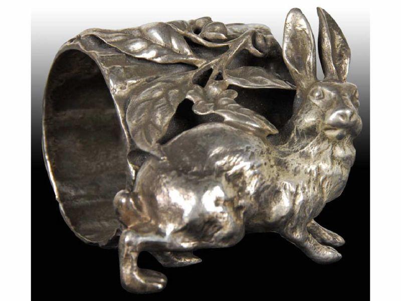 Appraisal: Crouching Rabbit by Log Figural Napkin Ring Description Marked Simpson