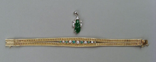 Appraisal: K white gold pendant with carved green jade single cut