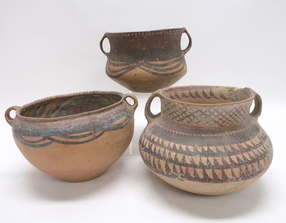 Appraisal: Three Chinese Neolithic Vessels Three wide mouth jars with high