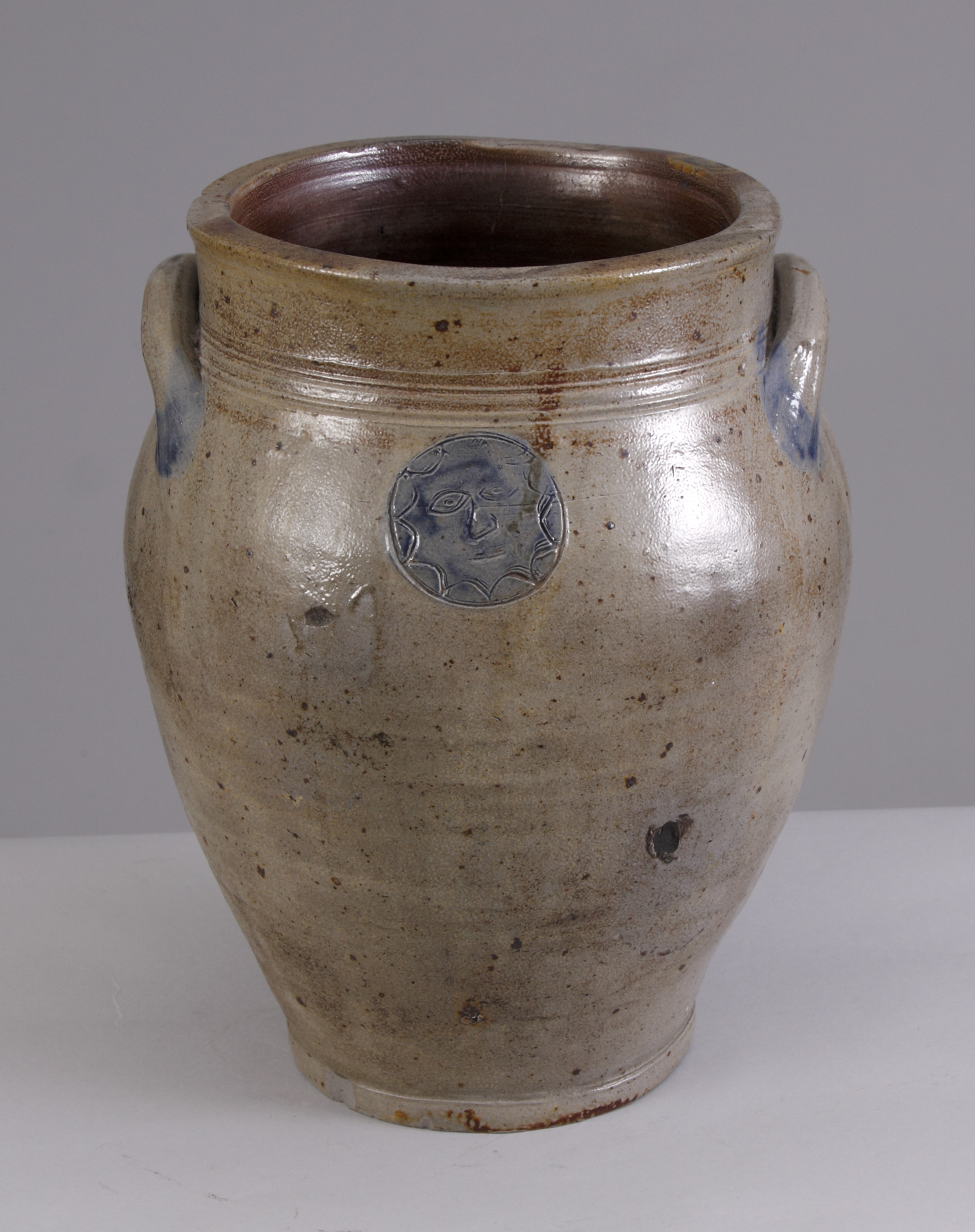 Appraisal: Stoneware Jar Stoneware jar w incised star face Chip to