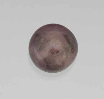 Appraisal: An Unmounted Color Change Star Sapphire Cabochon Cabochon cut carat