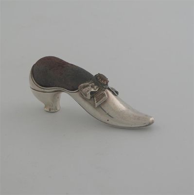 Appraisal: A Victorian ladies high heeled shoe with an applied bow