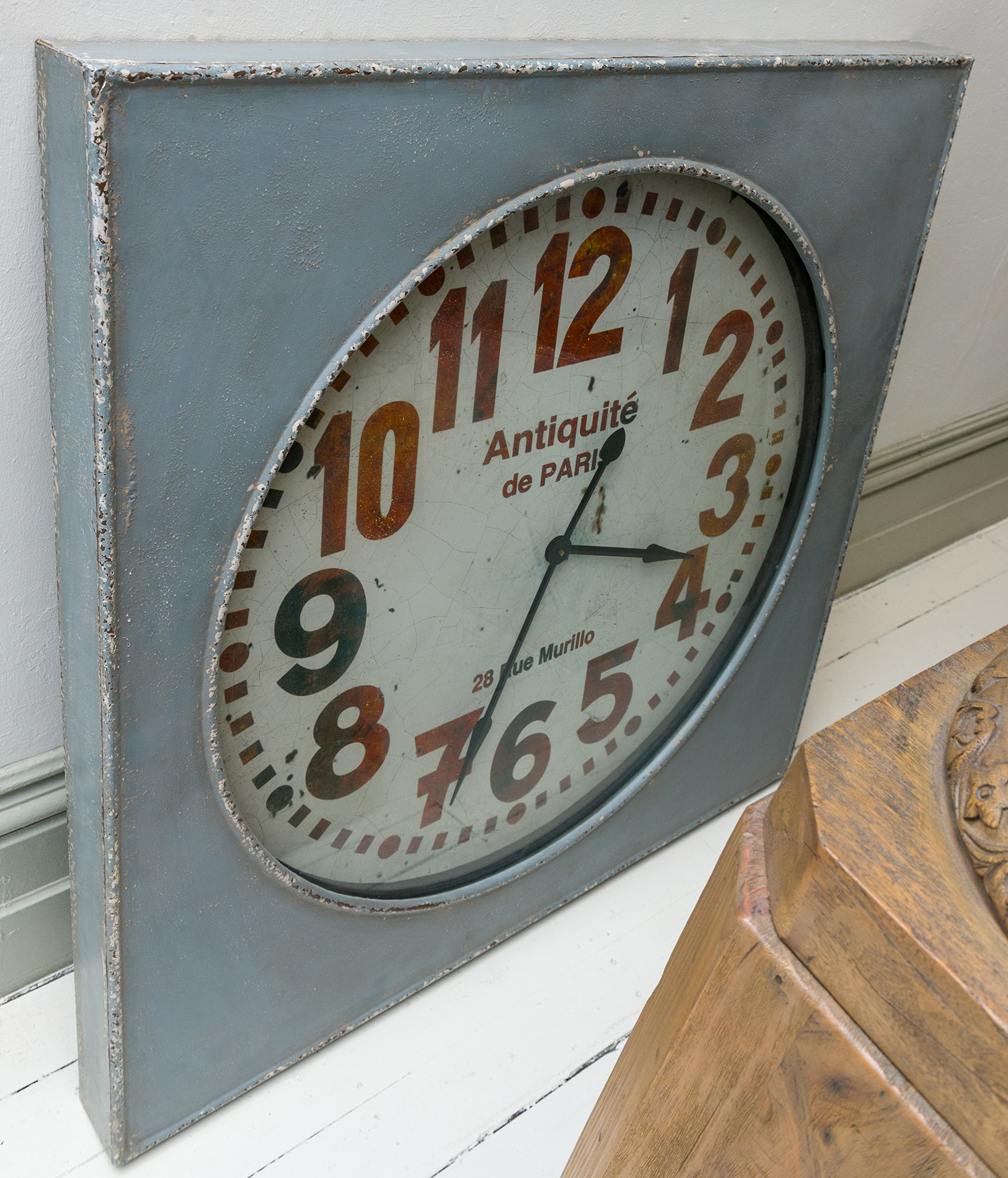 Appraisal: A LARGE PARISIAN THEMED CLOCK FACE HOUSED IN A RUSTIC