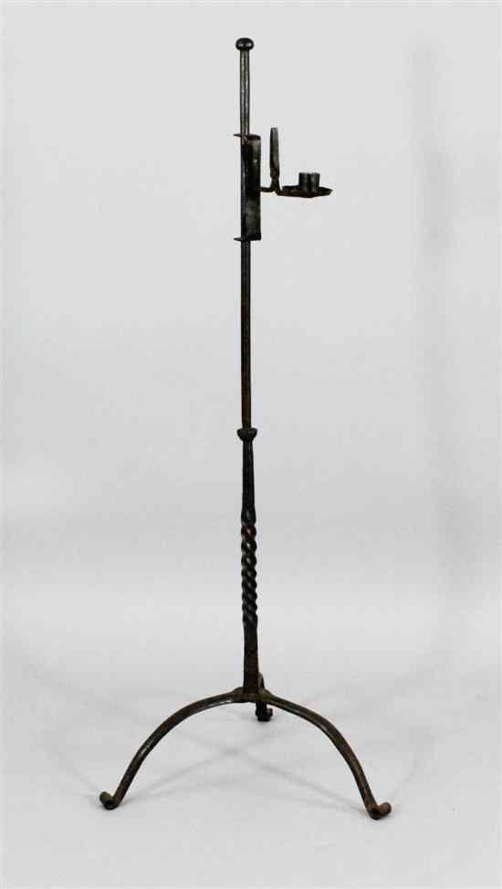 Appraisal: A standing iron adjustable rushlight nip and candleholder English early