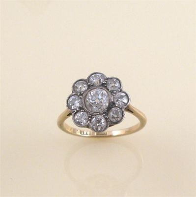 Appraisal: A diamond cluster ring the central old circular cut diamond