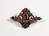 Appraisal: BROOCH - Victorian garnet shield form brooch set throughout with