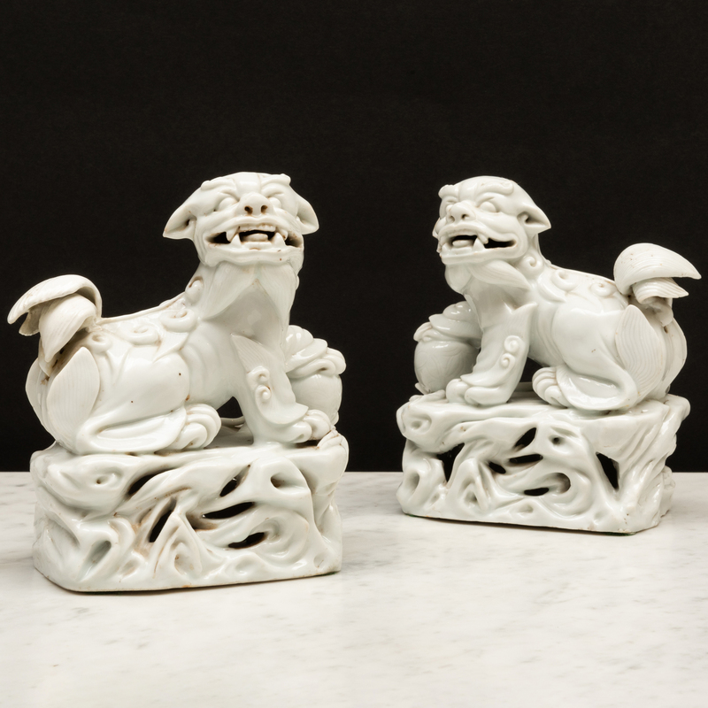 Appraisal: Pair of Blanc de Chine Porcelain Buddhistic Lions Unmarked x