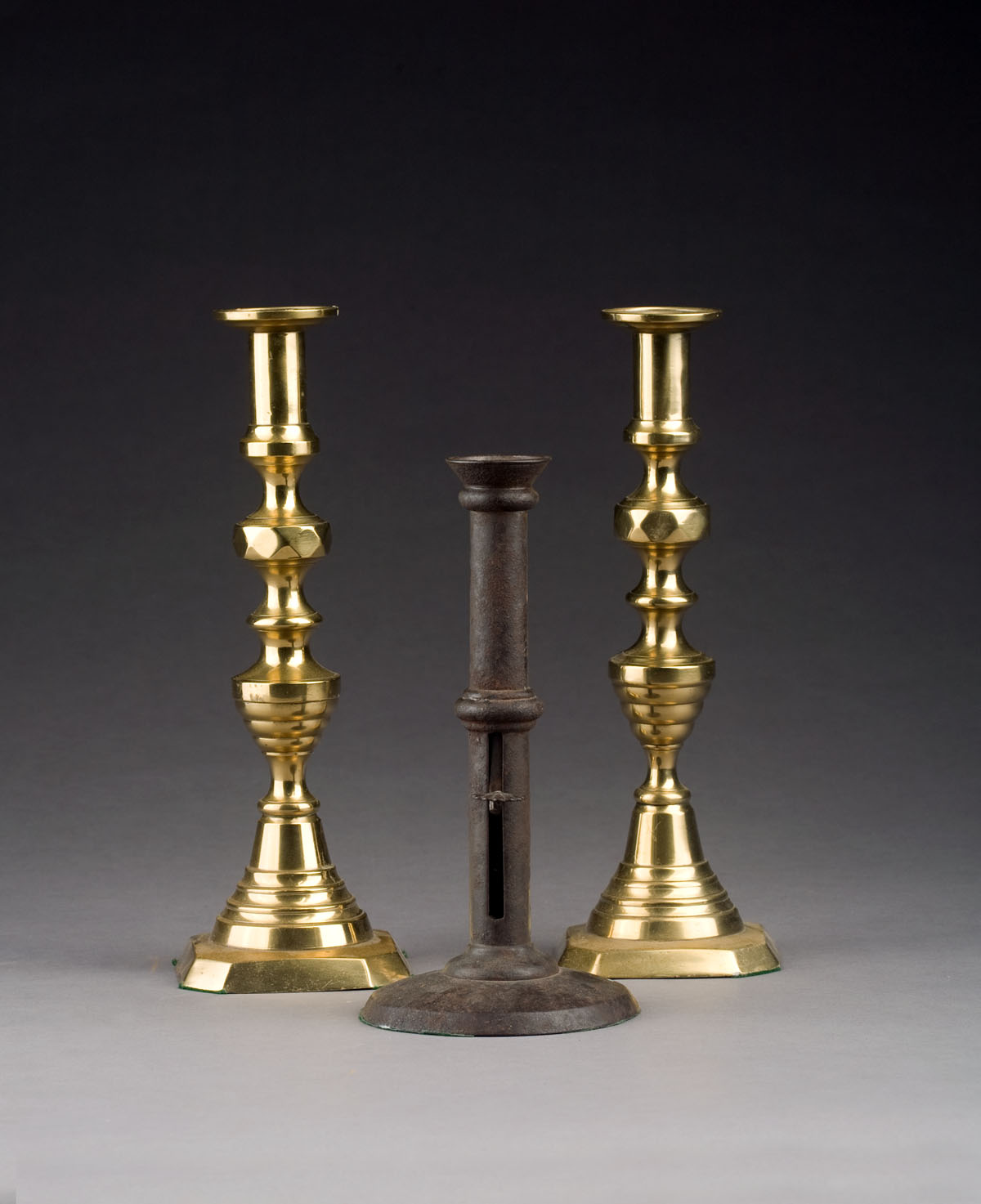 Appraisal: PAIR OF BRASS QUILTED BEEHIVE CANDLESTICKS TOGETHER WITH A RINGED