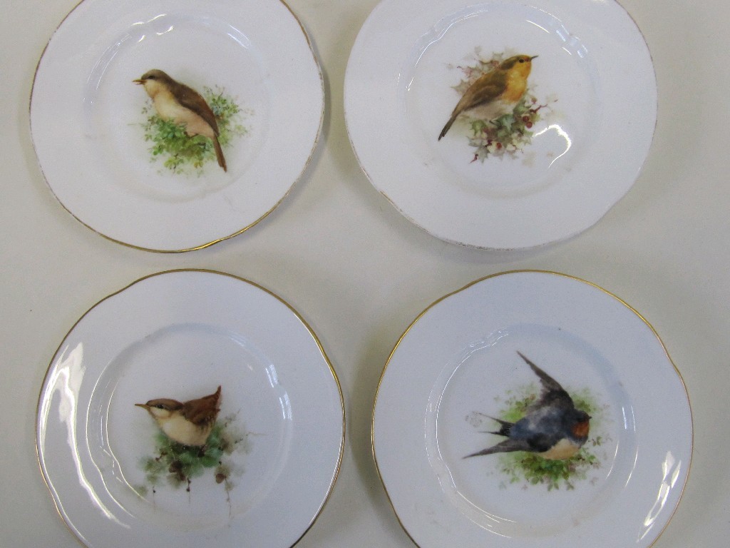 Appraisal: Set of four handpainted Royal Worcester plates each decorated with