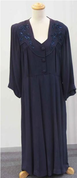 Appraisal: Cocktail dress in navy crepe with beaded details to the