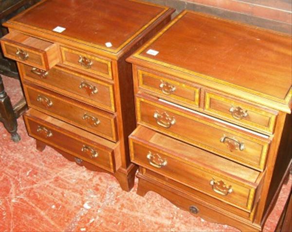 Appraisal: A pair of mahogany and satinwood crossbanded bedside chests of