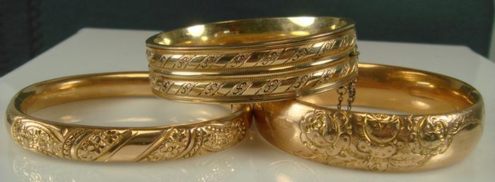 Appraisal: Gold-filled Bangle Bracelets Grouping of three all chase decorated and