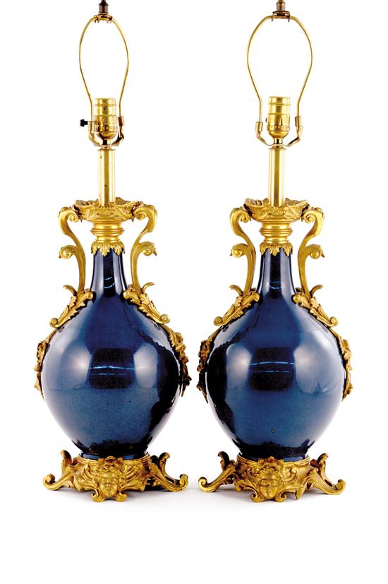 Appraisal: Pair French ormolu mounted porcelain vases th century undulating scrolling