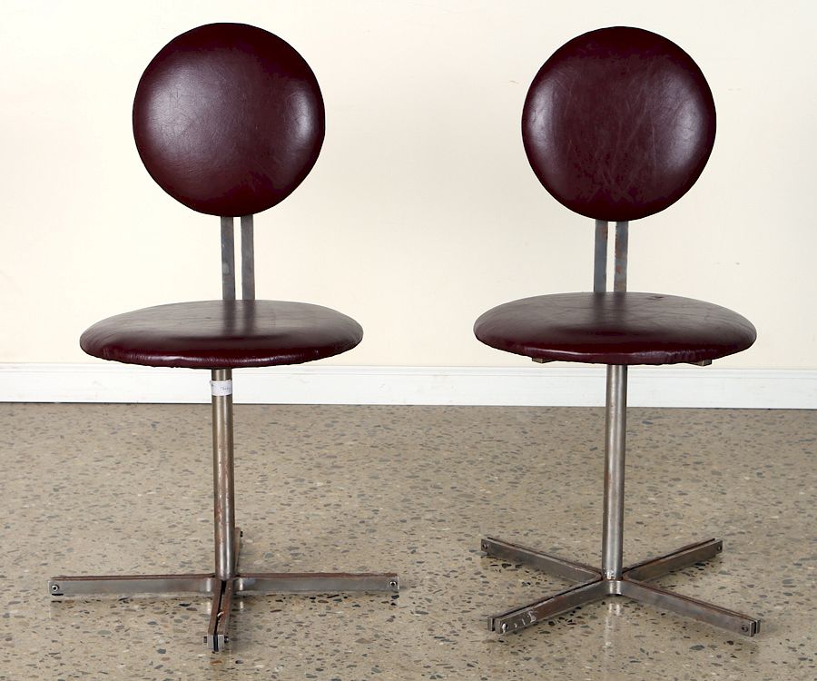 Appraisal: PAIR ITALIAN UPHOLSTERED STEEL SWIVEL CHAIRS A pair of Italian