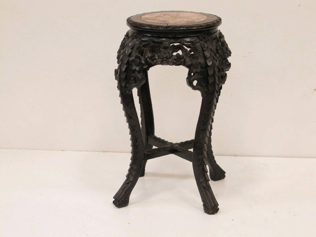 Appraisal: An Oriental hardwood Plantstand with inset marble top and pierced