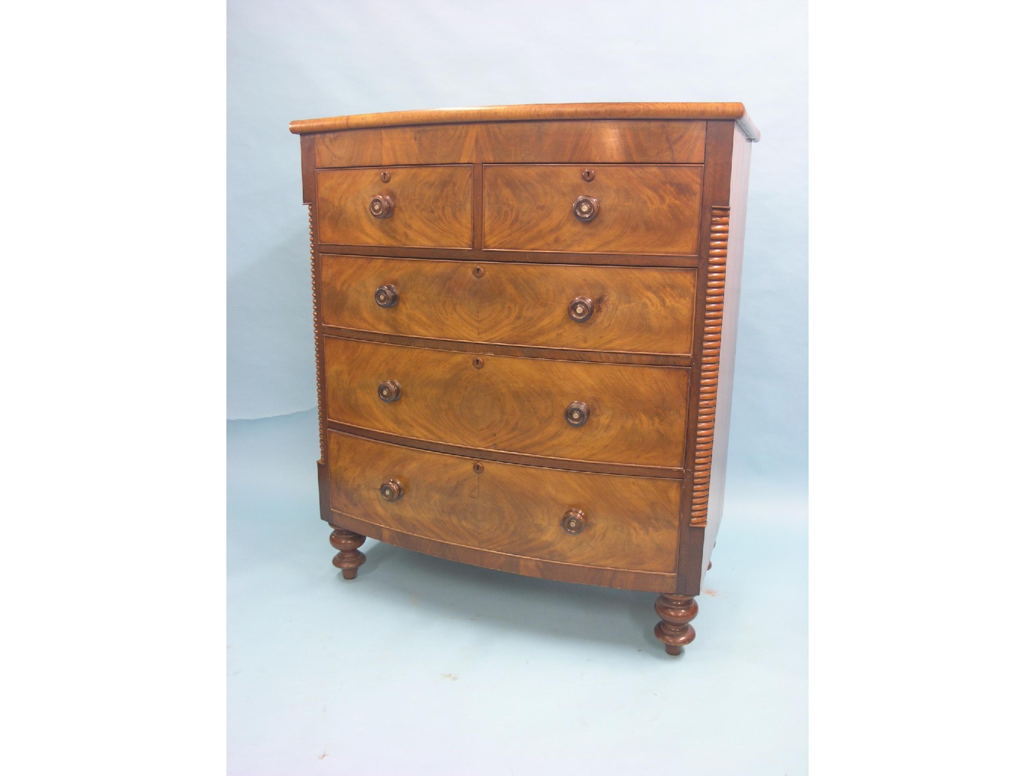 Appraisal: A Victorian mahogany bow-fronted chest two short and three long