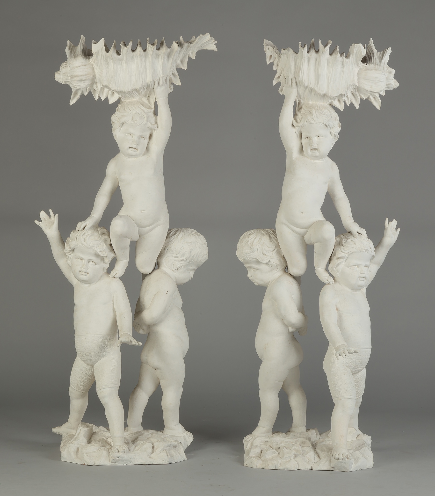 Appraisal: Pair of Carved Putti Pedestals Early th century Painted wood