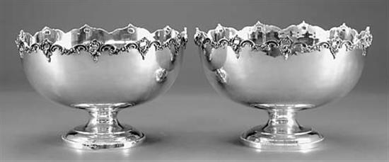 Appraisal: Pair silverplate punch bowls pierced rocaille-decorated rim above round form