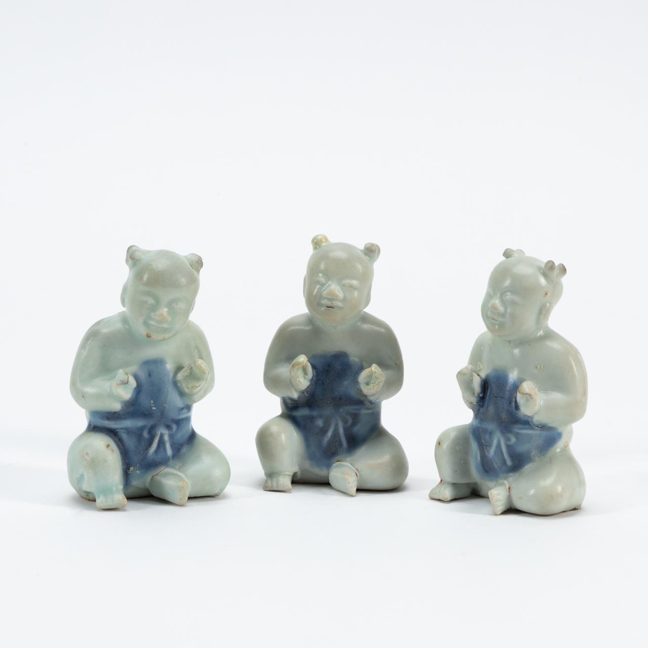 Appraisal: BLUE WHITE DIMINUTIVE LAUGHING BOY FIGURES Set of three small