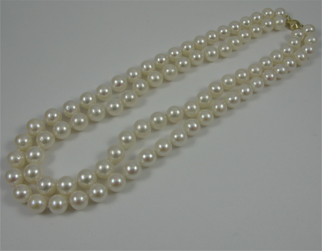 Appraisal: DOUBLE STRAND PEARL AND K GOLD NECKLACE in length and