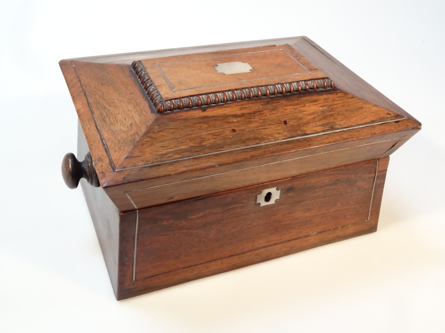 Appraisal: An thC rosewood sewing box the sarcophagus lid centred with