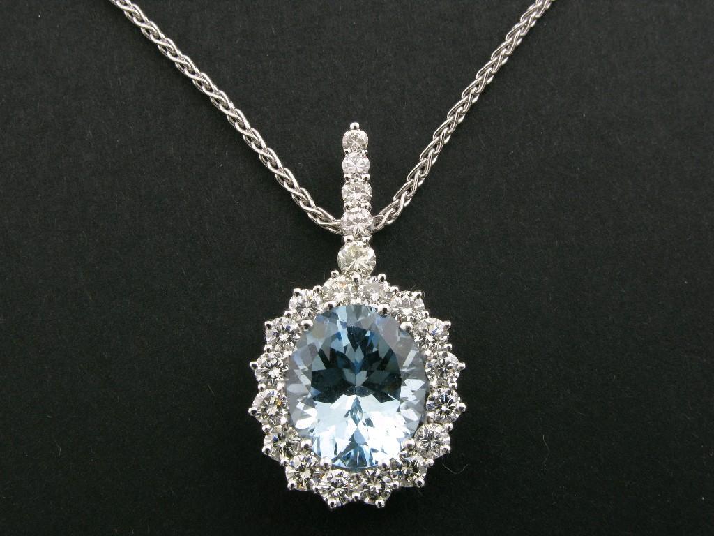 Appraisal: A Continental Aquamarine and Diamond Pendant claw-set oval-cut aquamarine cts