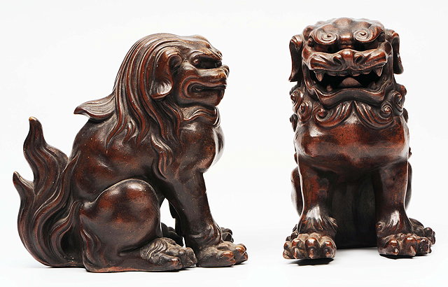 Appraisal: A PAIR OF CHINESE POTTERY BROWN GLAZED DOGS OF FO