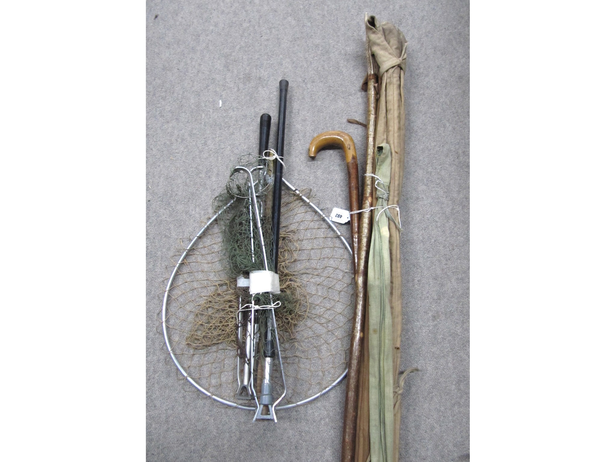 Appraisal: A lot comprising three fishing rods a net a shepherd's