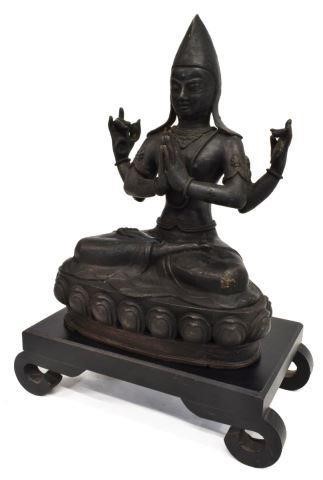 Appraisal: Tibetan bronze four-arm Buddha Chenrezig seated on a lotus base